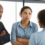 **

A group of diverse colleagues actively listening in a bright office setting. Focus on facial expressions showing empathy and understanding. Include subtle body language cues indicating engagement, such as nodding and maintaining eye contact. The overall tone is positive and collaborative.

**